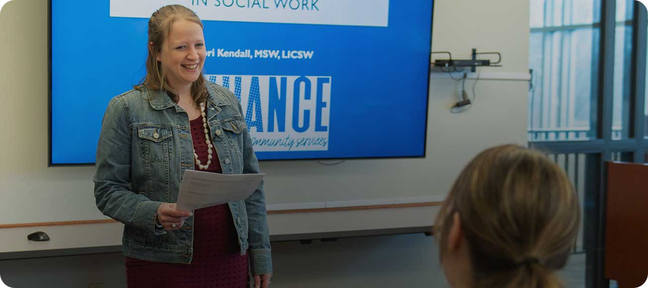 lori kendall teaching class with student