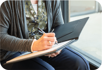 lori kendall writing in notebook