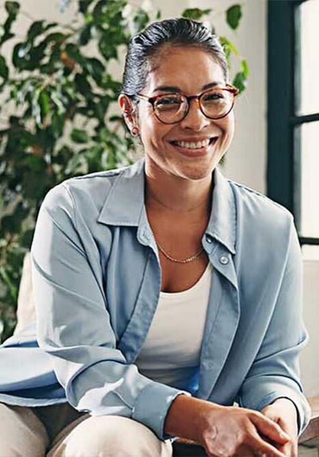 female sitting on chair smiling during meeting