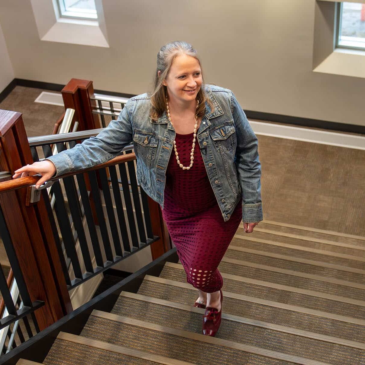 lori kendall walking up the stairs